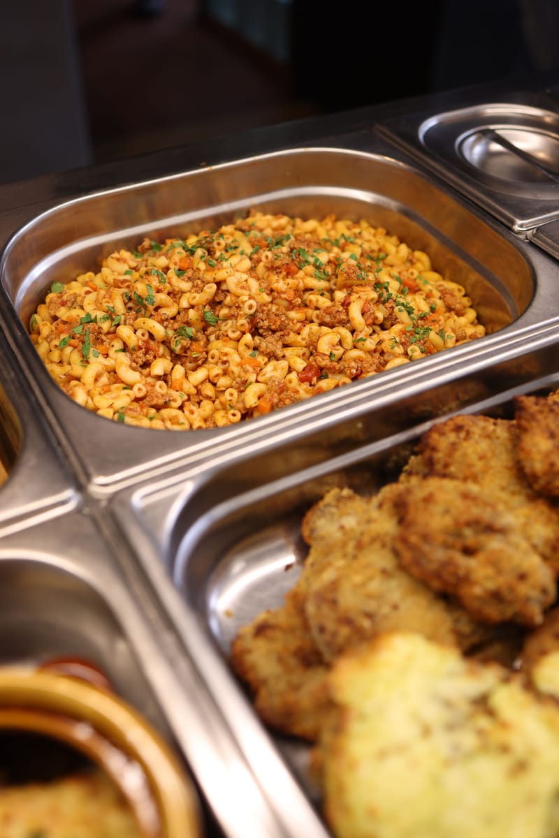 Placeholder photograph of warm dishes on a buffet line